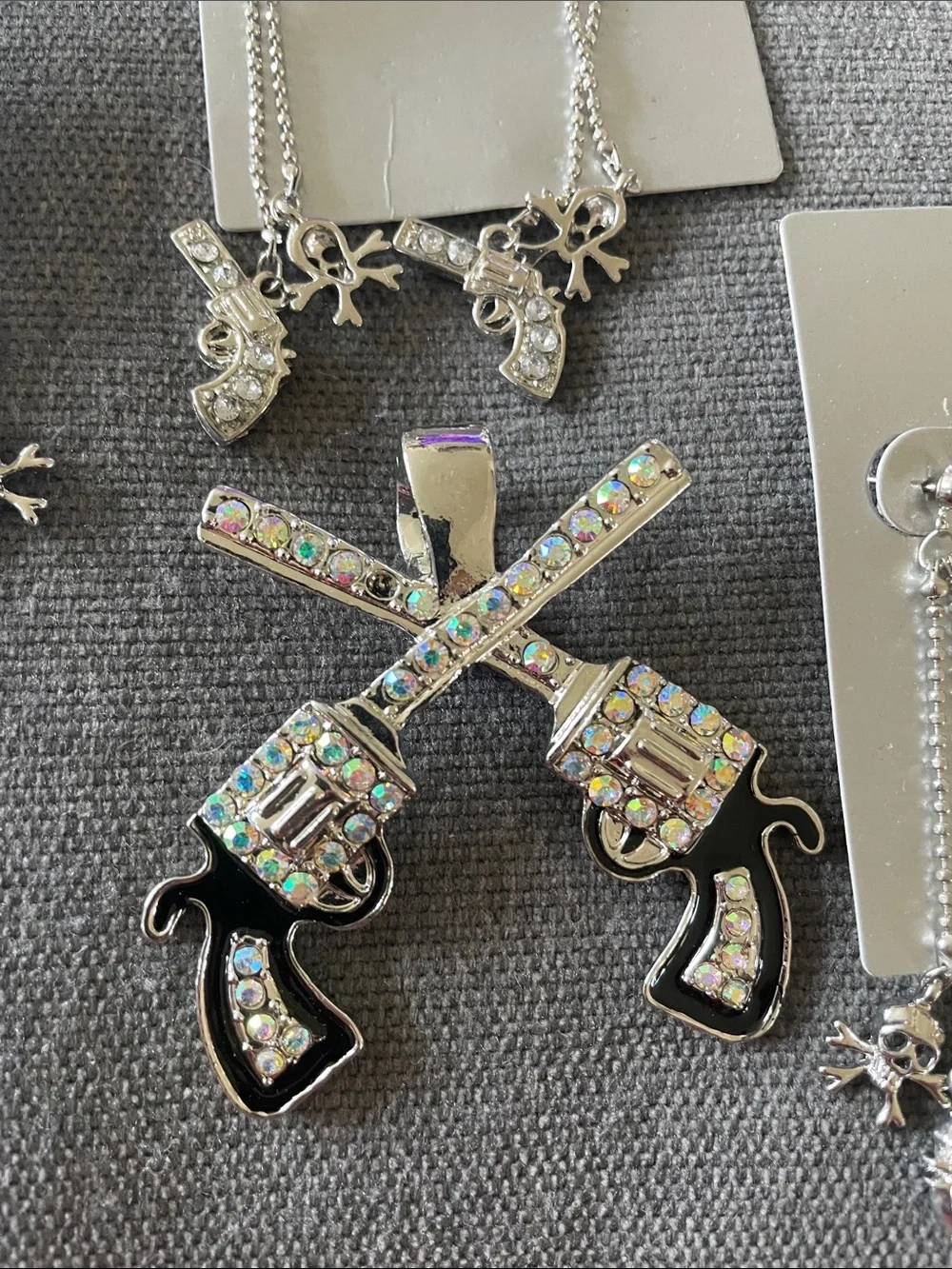 Hot Topic Silver Rhinestone Crossed Gun Pendant and Dangle Earring Set